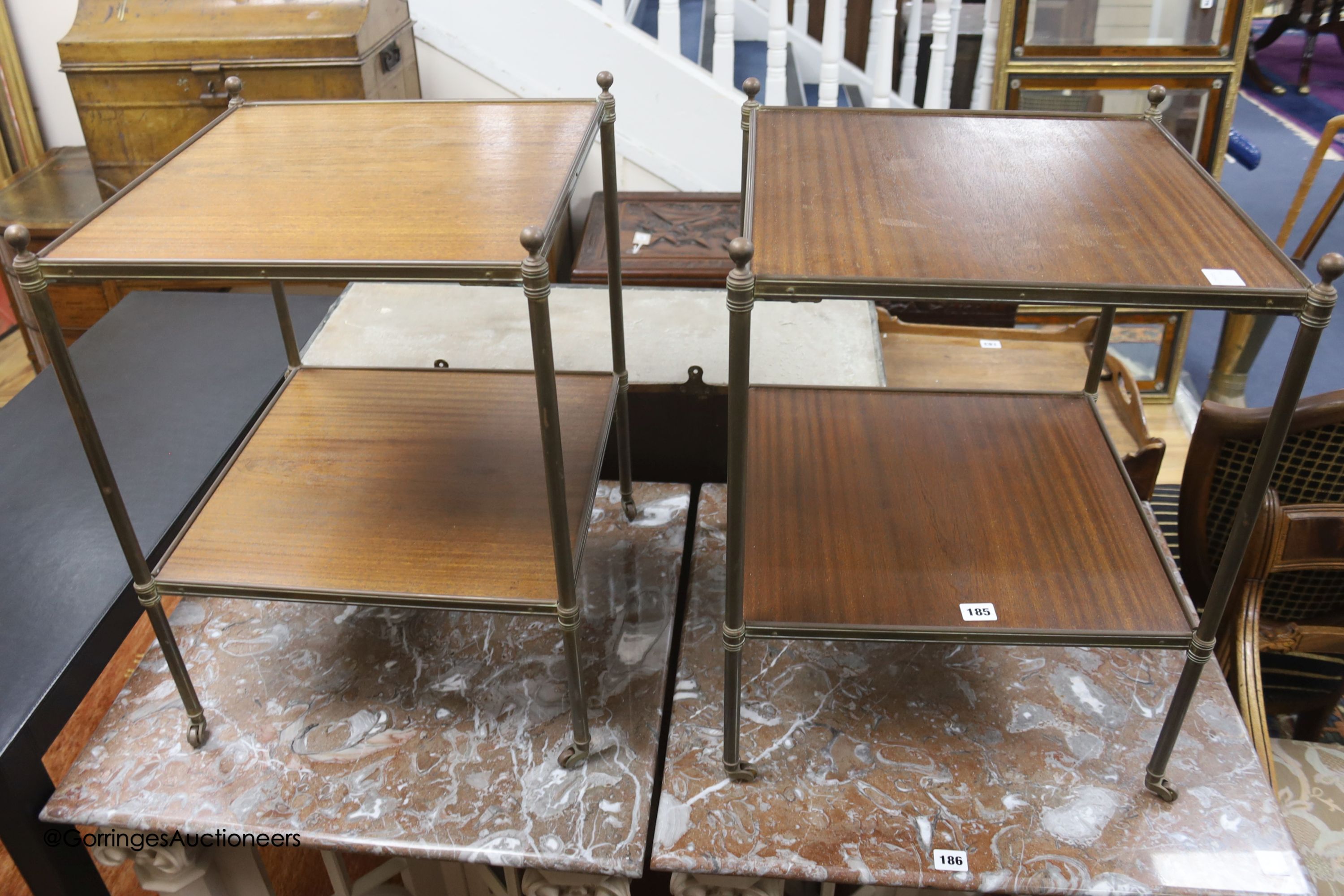 A pair of brass and teak two tier occasional tables, width 44cm depth 44cm height 58cm